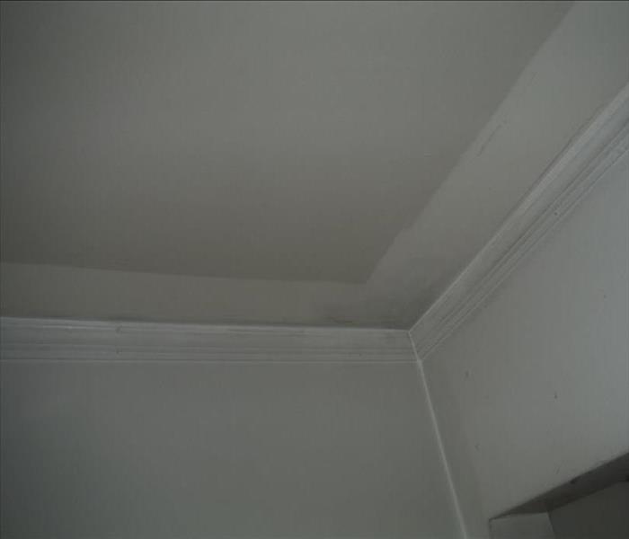 Ceiling in the kitchen in a Manchester home when SERVPRO of Lecay, Manchester just started the cleaning process 